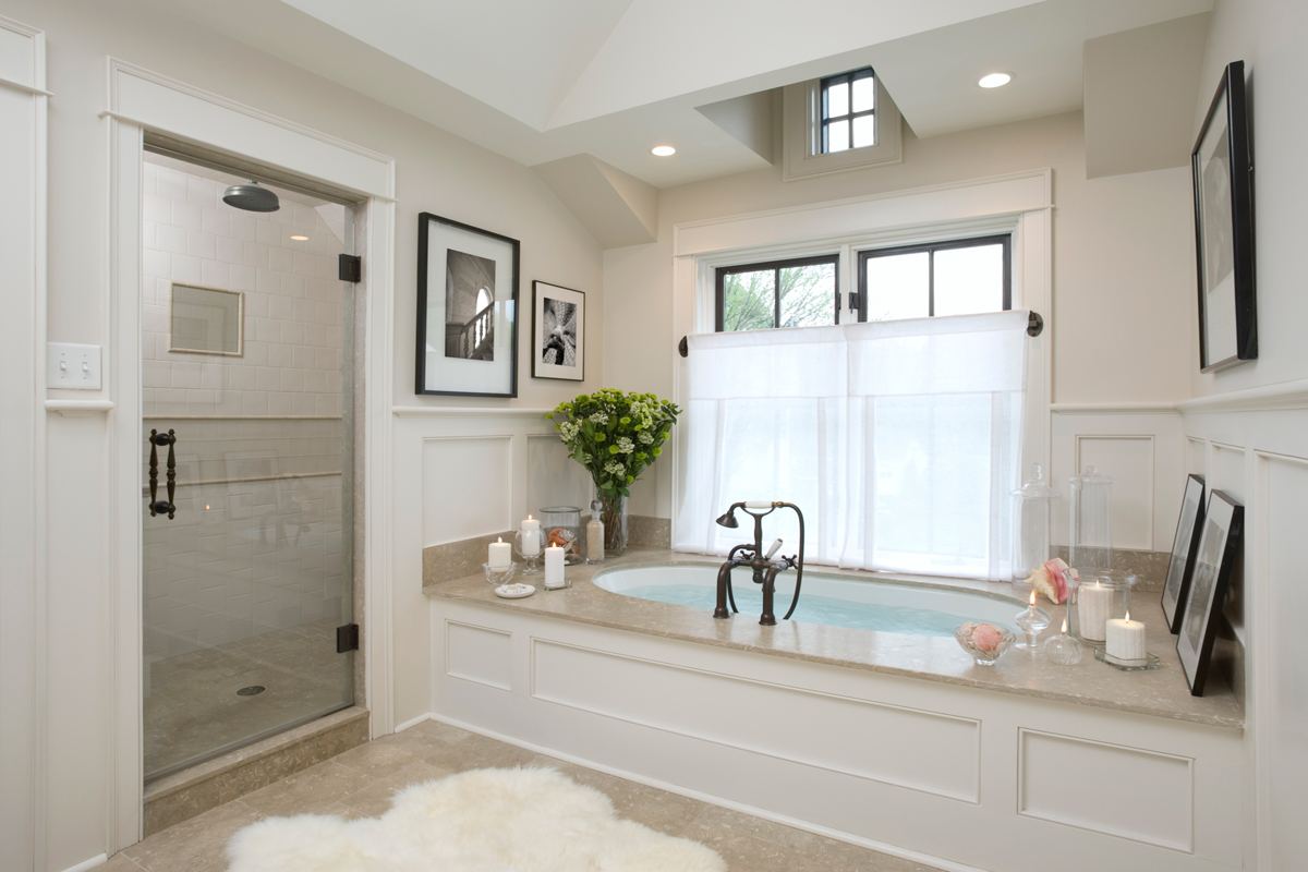 Master bathroom remodel with a soaking tub and frameless glass shower